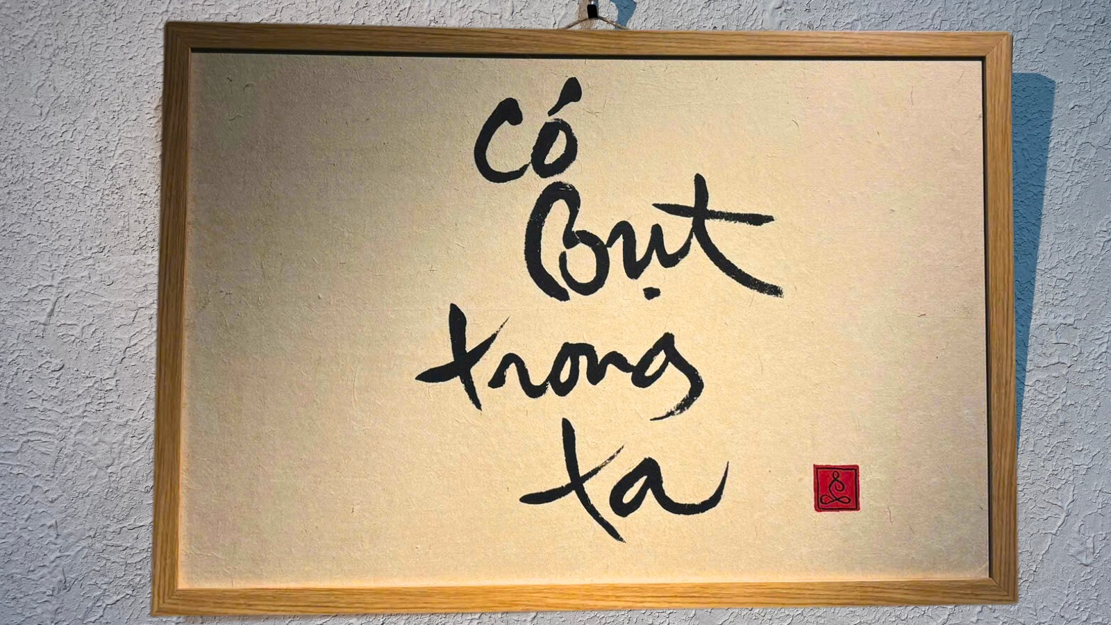 Tranh thư pháp có bụt trong ta